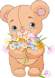 Teddy bear giving bouquet