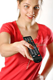young girl watching tv using a remote control