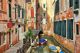Small canal among buildings. Venice, Italy.