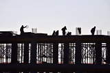 Silhouette of people working and building construction