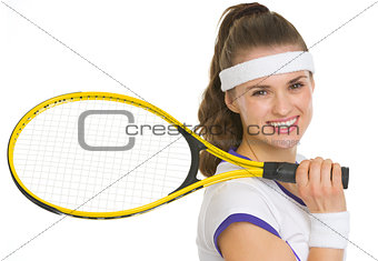 Portrait of smiling tennis player with racket