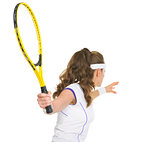 Tennis player ready to hit ball. rear view