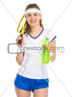 Happy tennis player with racket and water bottle