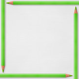 green pencils on white paper background