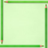 green pencils on paper background