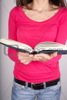pink sweater woman reading