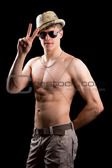 Young man showing victory gesture 