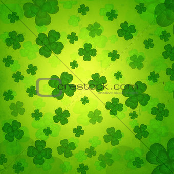striped four-leaved shamrocks in green old paper background