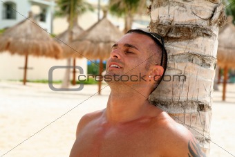 Young Man Relaxing on Beach