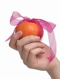 One tasty orange lays in a hand