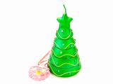 new-year candle in form the decorated fir-tree on a white background