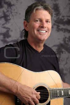 Stock Photo of Mature Male Guitarist 4