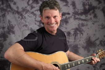Stock Photo of a Mature Male Guitarist 6