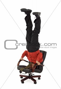 Businessman relaxing on office chair - unusual position