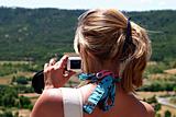 Blonde woman with digital camera