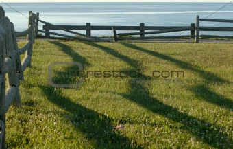 Fence shadows at sunrise