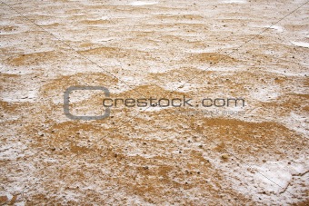sand covered with thin snow 