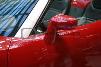 Left Side Mirror Of Shiny Red Car