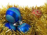 Christmas blue ornaments and gold tinsel