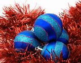 Christmas blue ornaments and red tinsel