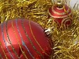 Christmas red ornaments and gold tinsel