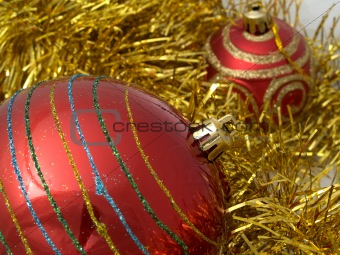 Christmas red ornaments and gold tinsel