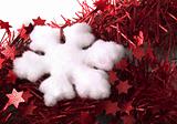 Christmas snowflake on red tinsel backrownd