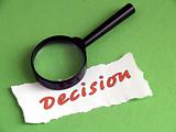 Decision, magnifier on green