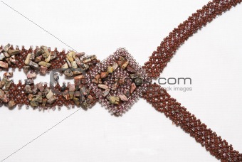 Fragment of a necklace from beads on a white background
