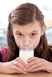 Young girl drinking milk