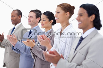 Close-up of a business team smiling and applauding 