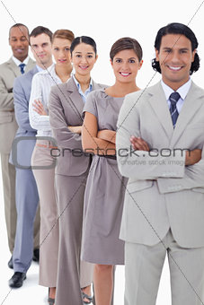 Close-up of a business team in a single line crossing their arms
