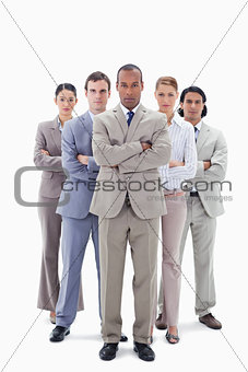 Determined business team crossing their arms