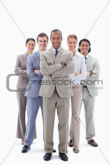 Smiling business team crossing their arms