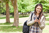 Portrait of a young student using a smartphone