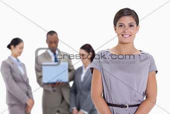 Woman business team in the background watching a laptop
