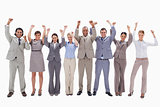 Happy business team raising their arms