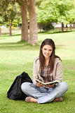 Teenager sitting with a textbook
