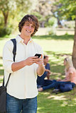 Portrait of a young man using a smartphone