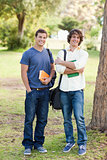 Portrait of two happy standing male students