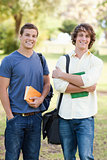 Portrait of two standing handsome students talking