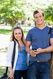 Portrait of two students with a smartphone