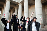 Graduates dancing in togas