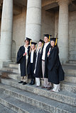 Graduates posing while smiling