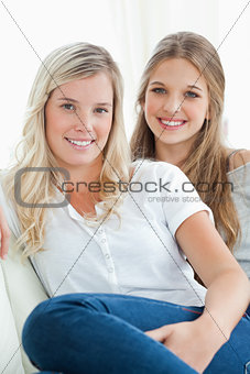 Close up of smiling girls on the couch