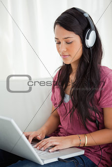 Close-up of a Latino student using a laptop