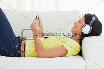 Smiling young woman watching a video