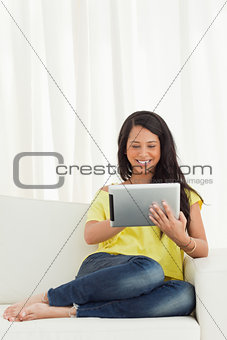 Happy Latino using a touch pad