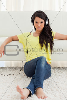 Beautiful Latin glowing while listening music
