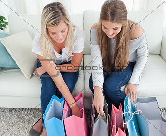 Girls looking into their shopping